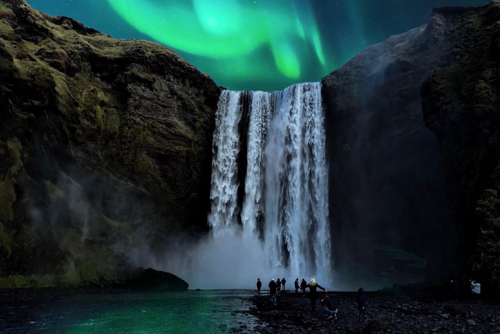 Northern light dancing over  Iceland Skogafoss 