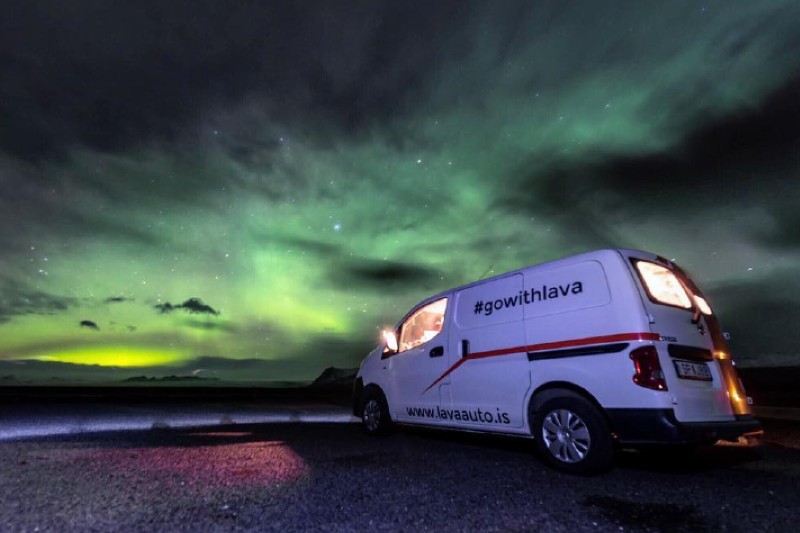 Camper under the northern lights in Iceland