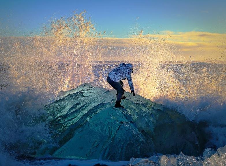 Waves crashing on iceberg