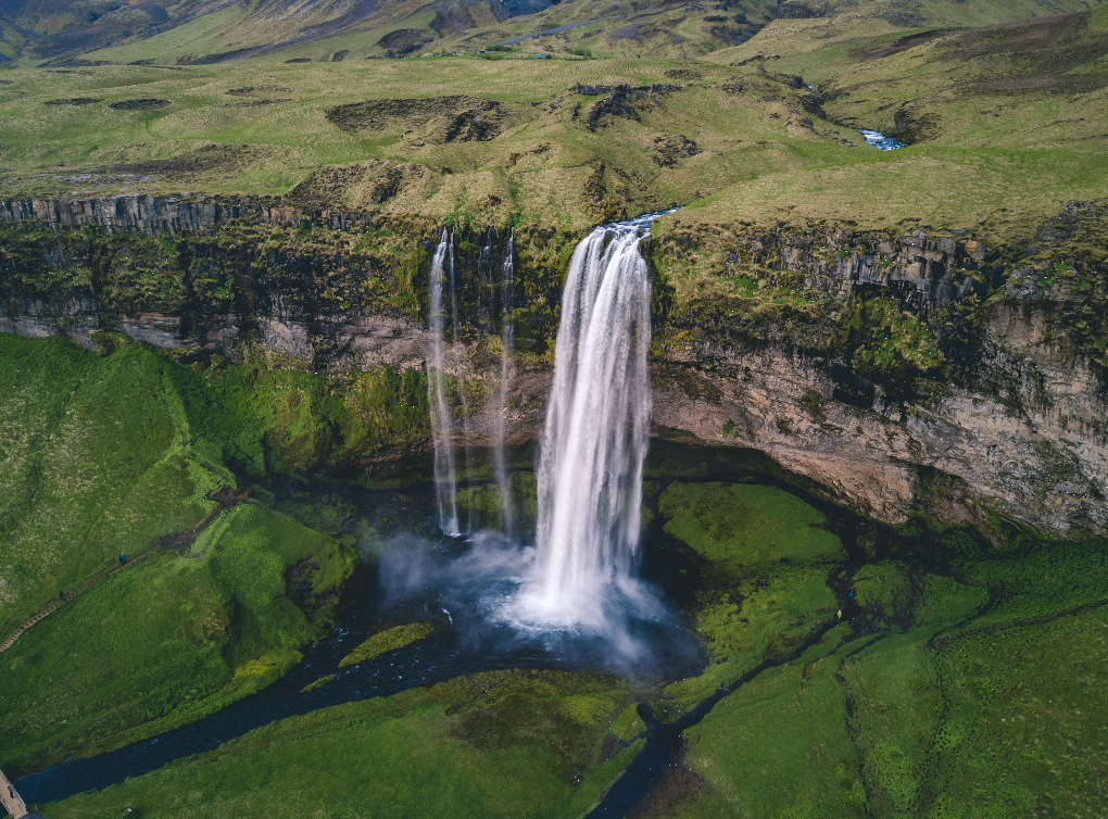 Seljalandsfoss waterfall in Iceland is known because you can walk behind the water courtain wall