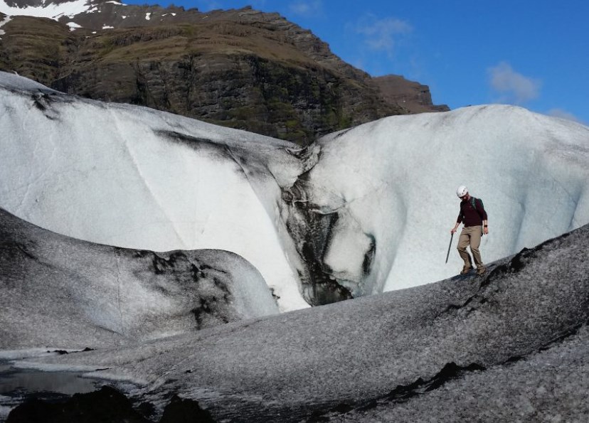 Man Hiking Near Icelandic Glacial